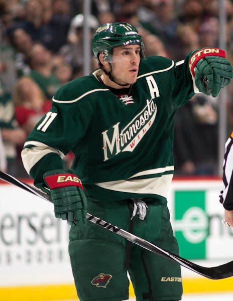 Minnesota Wild left wing Zach Parise (11) argues against a interference call that cost the Wild a goal in the second period with referee Dean Morton. 