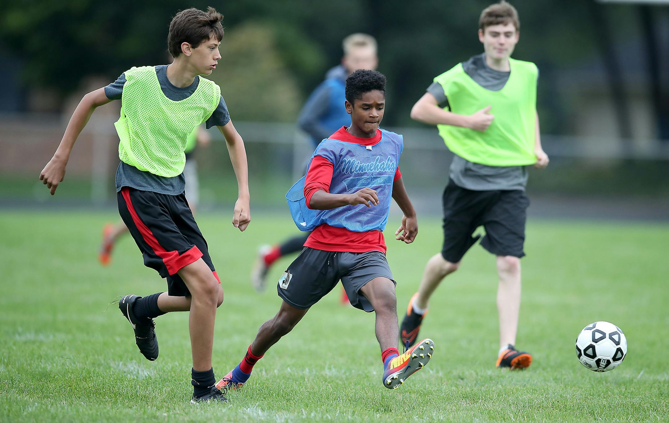 The Minnehaha Academy boys' soccer team took to the field for practice Monday, nearly two weeks since a natural gas explosion tore through the school's upper campus and killed two school workers. Assistant soccer coach Bryan Duffey was severely injured in the blast and remains hospitalized, his right leg amputated at the knee.