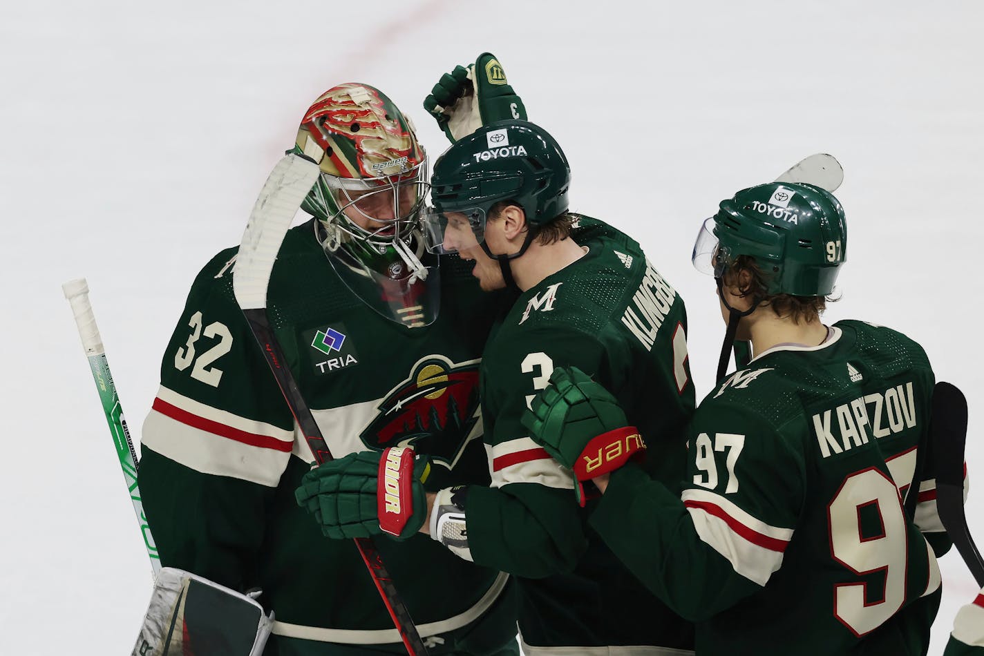 Minnesota Wild defenseman John Klingberg (3) celebrates with goaltender Filip Gustavsson (32) after winning 5-1 against the Dallas Stars following Game 3 of an NHL hockey Stanley Cup first-round playoff series Friday, April 21, 2023, in St. Paul, Minn. (AP Photo/Stacy Bengs)