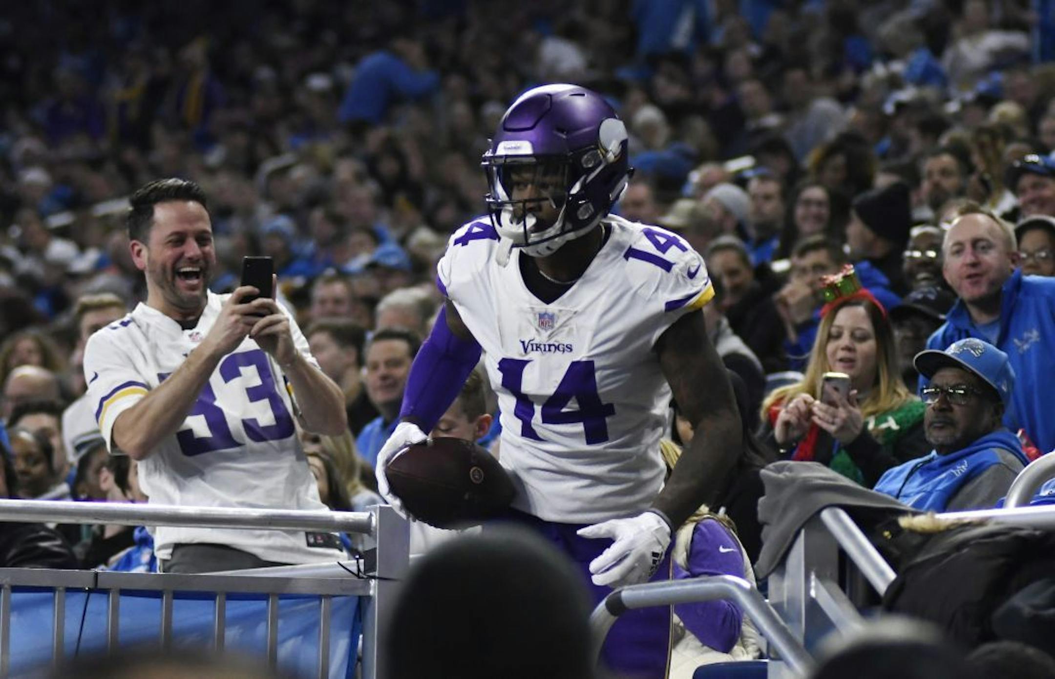 Minnesota Vikings wide receiver Stefon Diggs (14) leaves the stands after scoring a touchdown during the first half of an NFL football game against the Detroit Lions, Sunday, Dec. 23, 2018, in Detroit.