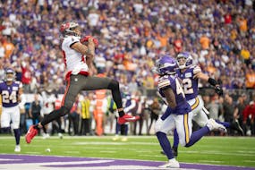 Tampa Bay Buccaneers wide receiver Mike Evans (13) pulls down a 27-yard touchdown catch over Minnesota Vikings linebacker Ivan Pace Jr. (40) in the se
