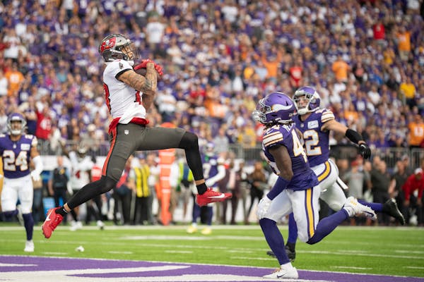 Tampa Bay Buccaneers wide receiver Mike Evans (13) pulls down a 27-yard touchdown catch over Minnesota Vikings linebacker Ivan Pace Jr. (40) in the se