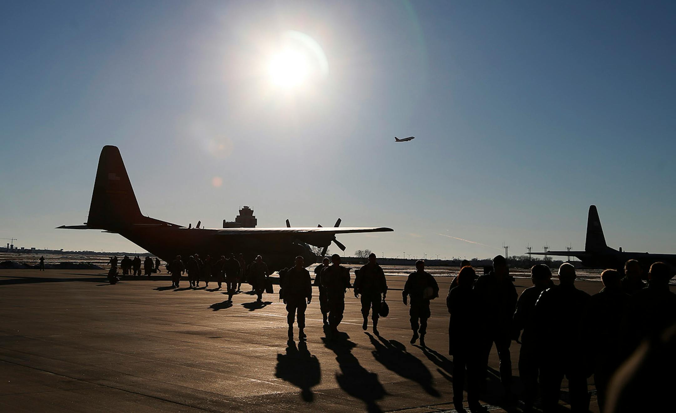Families gather for the arrival of the more than 100 Airmen and three C-130 H3 Hercules aircraft from the 934th Airlift Wing, Air Force Reserve, return from their deployment to Southwest Asia after their four-month tour of duty. Sunday January 18, 2015 Minneapolis, MN.] Jerry Holt/ Jerry.Holt@Startribune.com