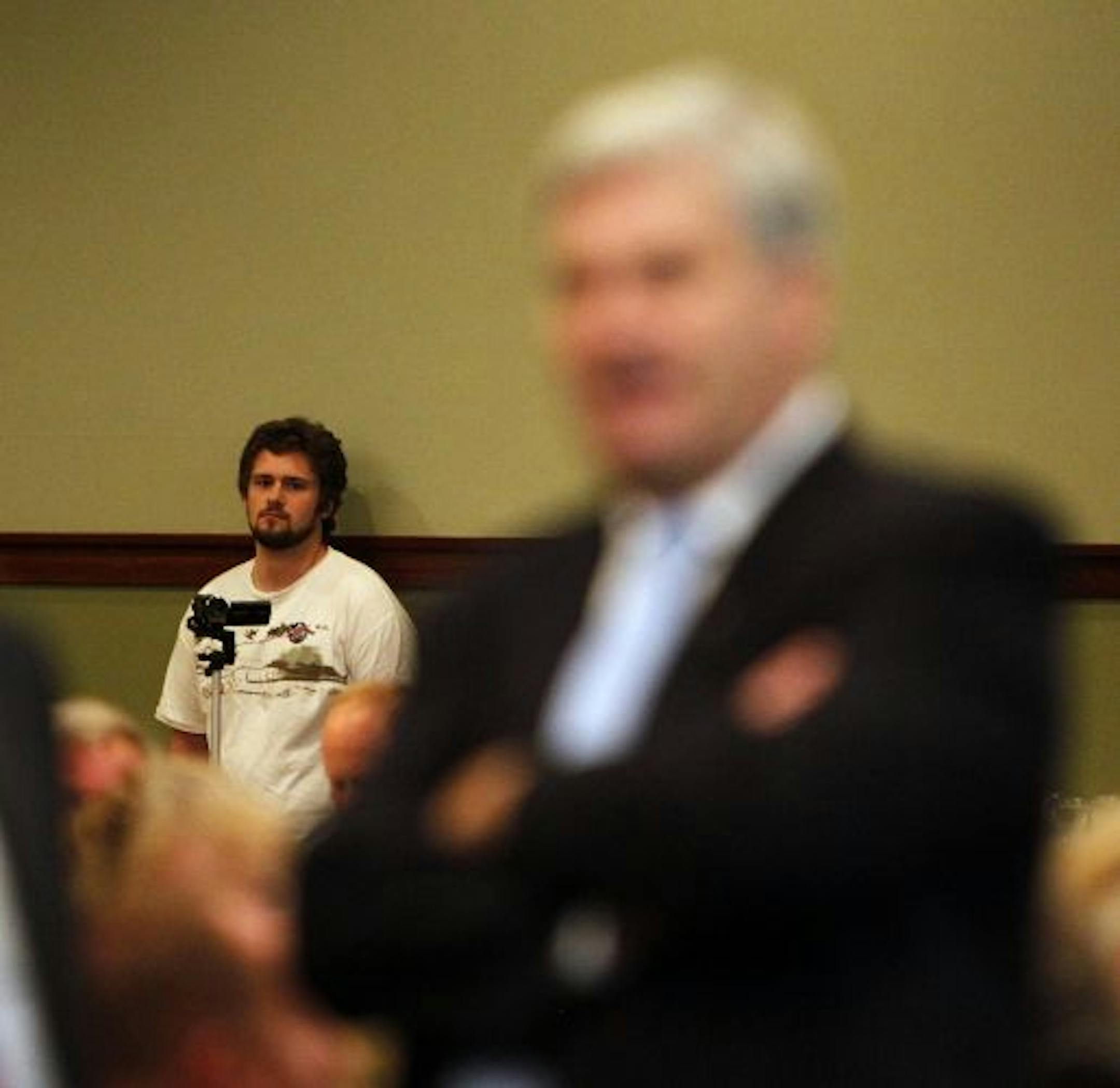 DFL tracker Colin Clark, with Emmer in his sights, waited for the debate to begin Tuesday at the Grand View Lodge in Nisswa.