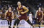 Loyola-Chicago guard Marques Townes reacts to hitting a 3-pointer in the final minute of the team's 69-68 victory over Nevada during an NCAA men's col