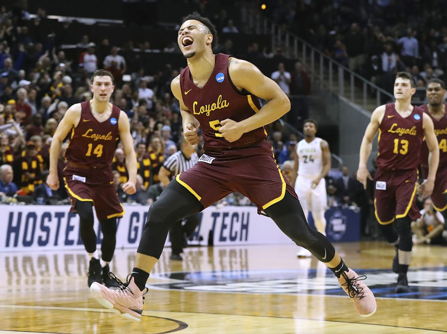 Loyola-Chicago guard Marques Townes reacts to hitting a 3-pointer in the final minute of the team's 69-68 victory over Nevada during an NCAA men's college basketball tournament regional semifinal.