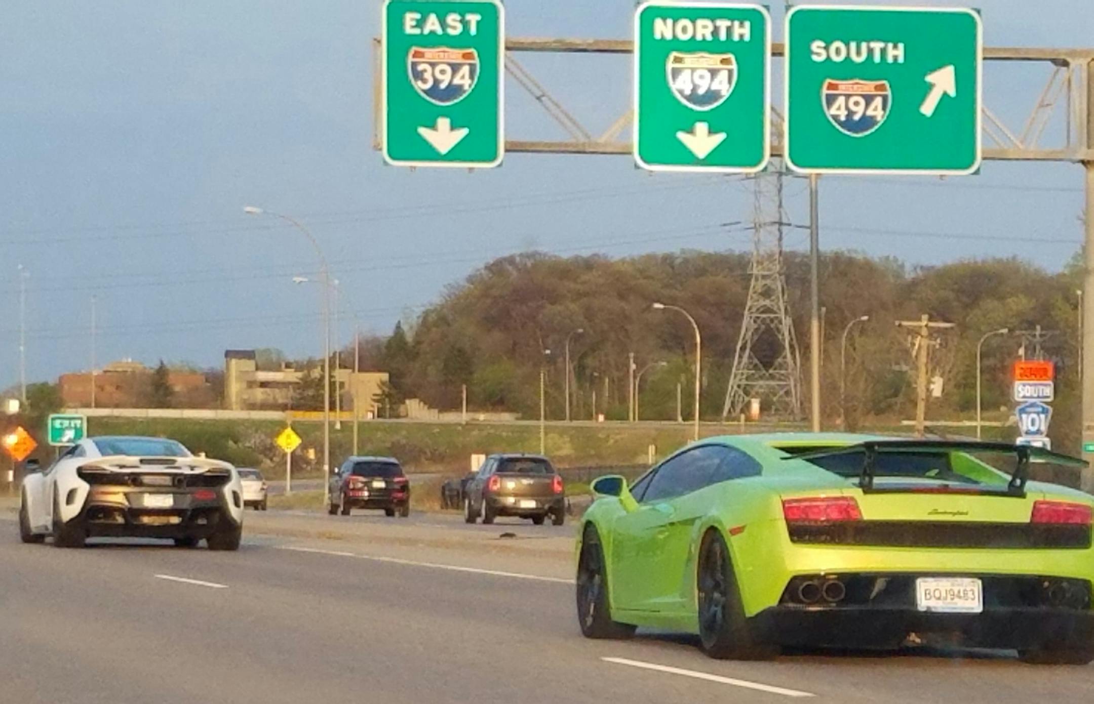 This photo taken April 23 by a motorist showed some of the high-end sports cars during their questionable cruise along Interstate 394.