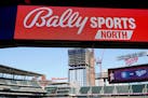 Signage for Bally Sports North is viewed before a baseball game between the Minnesota Twins and Houston Astros in 2023.