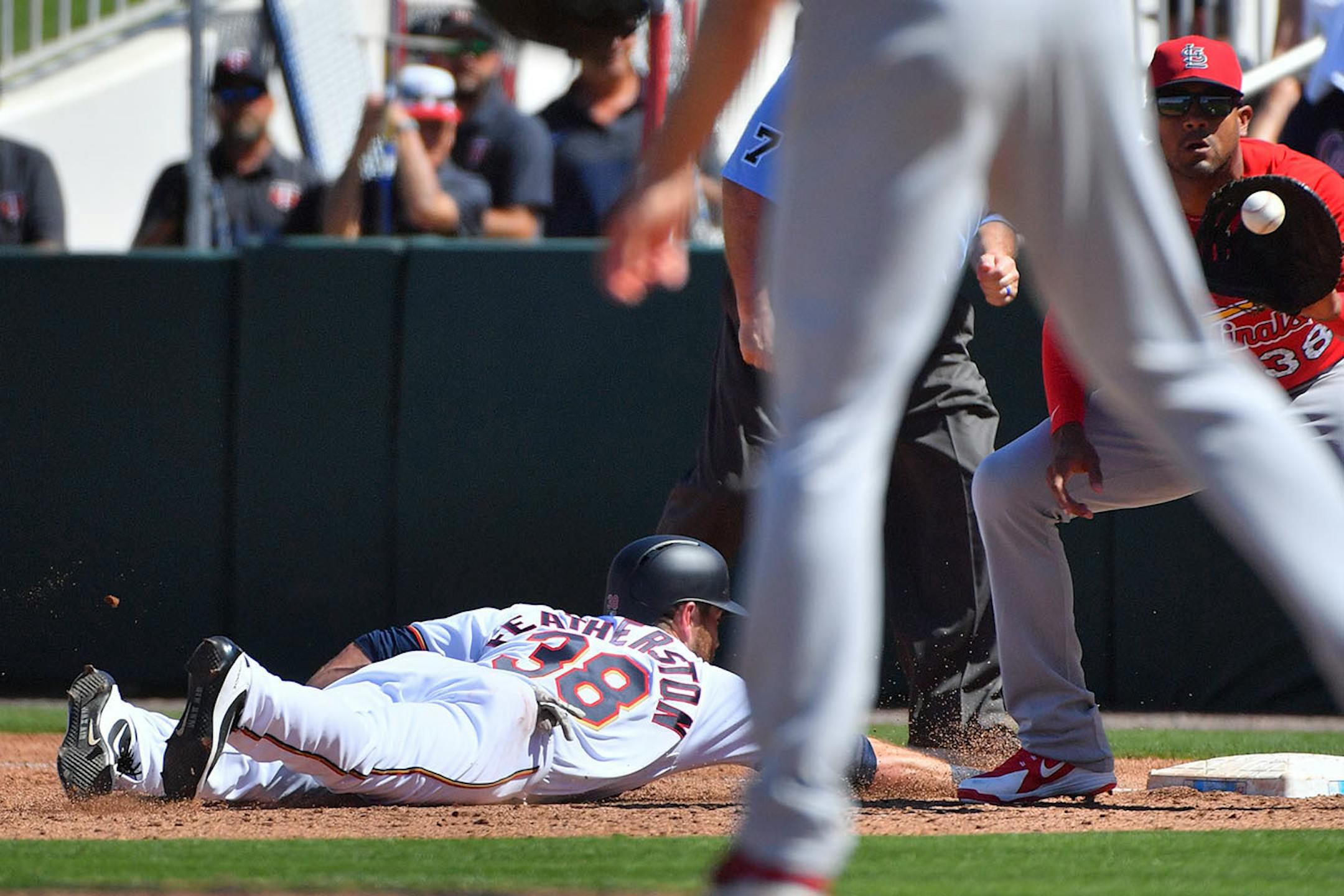 Twins infielder Taylor Featherston (38) beat Cardinals first baseman Jose Martinez back to the sack in the third inning.