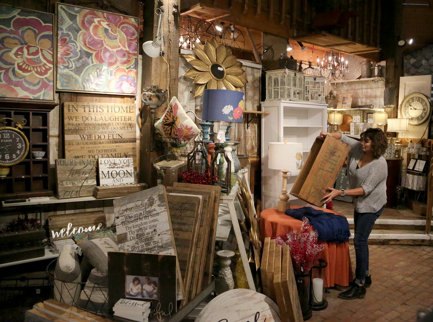 Employee Liz Mugford, a buyer, organizes on the floor at the General Store of Minnetonka Tuesday, Sept. 26, 2017, in Minnetonka, MN.] DAVID JOLES &#xef; david.joles@startribune.com While the travails of national retailers have gotten the most notice, local shops also must adapt in the era of Amazon and widespread online shopping. These sorts of stores have always needed to find ways to seem special and interesting to attract business, but that pressure is only increasing,,cq