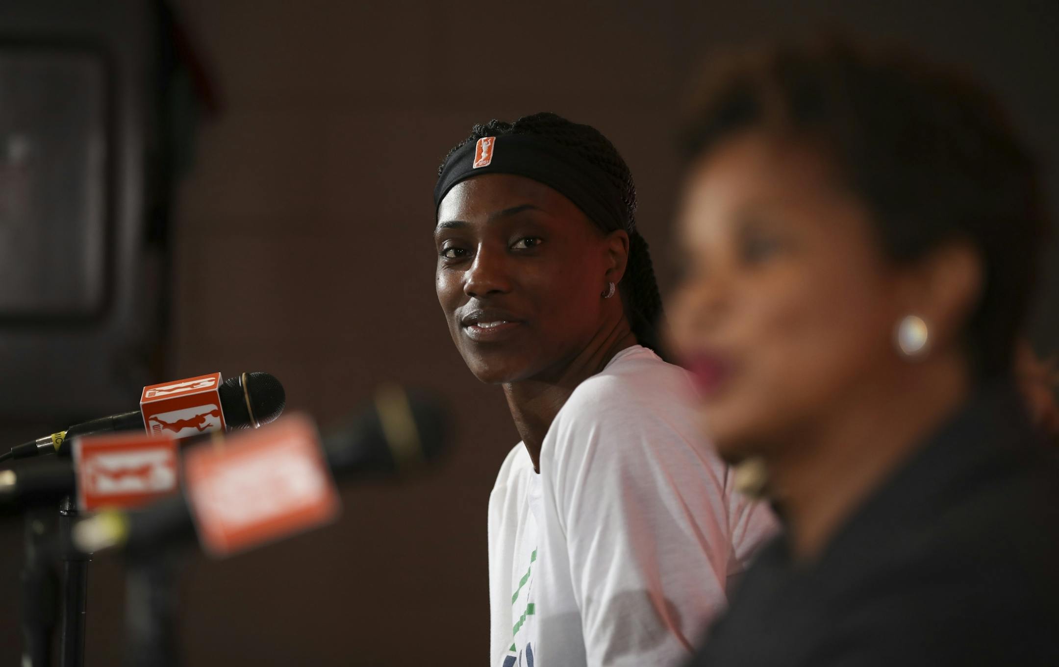 Sylvia Fowles listened as WNBA Rene� Brown, WNBA Chief of Basketball Operations and Player Relations, introduced her before presenting her with the league's Defensive Player of the Year trophy at a news conference before Friday night's game.