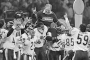 FILE - In this Jan. 26, 1986, file photo, Chicago Bears defensive coordinator Buddy Ryan is carried off the field by the team after the Bears beat the