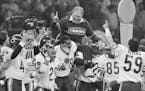 FILE - In this Jan. 26, 1986, file photo, Chicago Bears defensive coordinator Buddy Ryan is carried off the field by the team after the Bears beat the