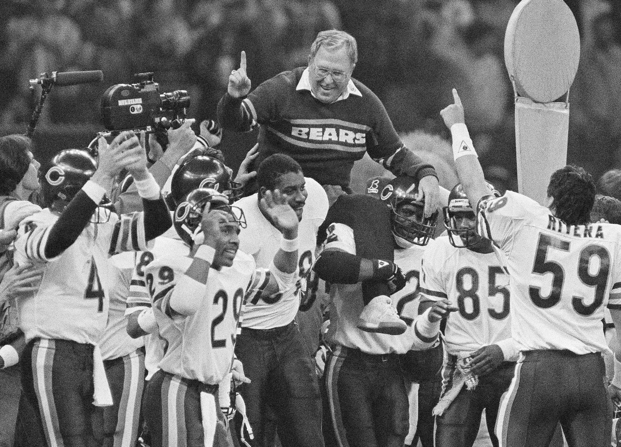 FILE - In this Jan. 26, 1986, file photo, Chicago Bears defensive coordinator Buddy Ryan is carried off the field by the team after the Bears beat the New England Patriots 46-10 in Super Bowl XX in New Orleans. Buddy Ryan, who coached two defenses that won Super Bowl titles and whose twin sons Rex and Rob have been successful NFL coaches, died Tuesday, June 28, 2016. He was 82. (AP Photo/File)