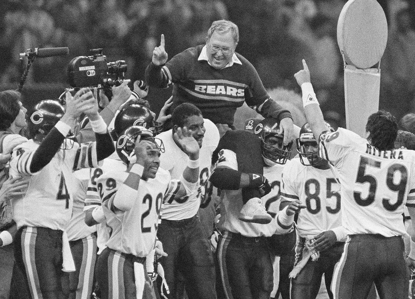 FILE - In this Jan. 26, 1986, file photo, Chicago Bears defensive coordinator Buddy Ryan is carried off the field by the team after the Bears beat the New England Patriots 46-10 in Super Bowl XX in New Orleans. Buddy Ryan, who coached two defenses that won Super Bowl titles and whose twin sons Rex and Rob have been successful NFL coaches, died Tuesday, June 28, 2016. He was 82. (AP Photo/File)