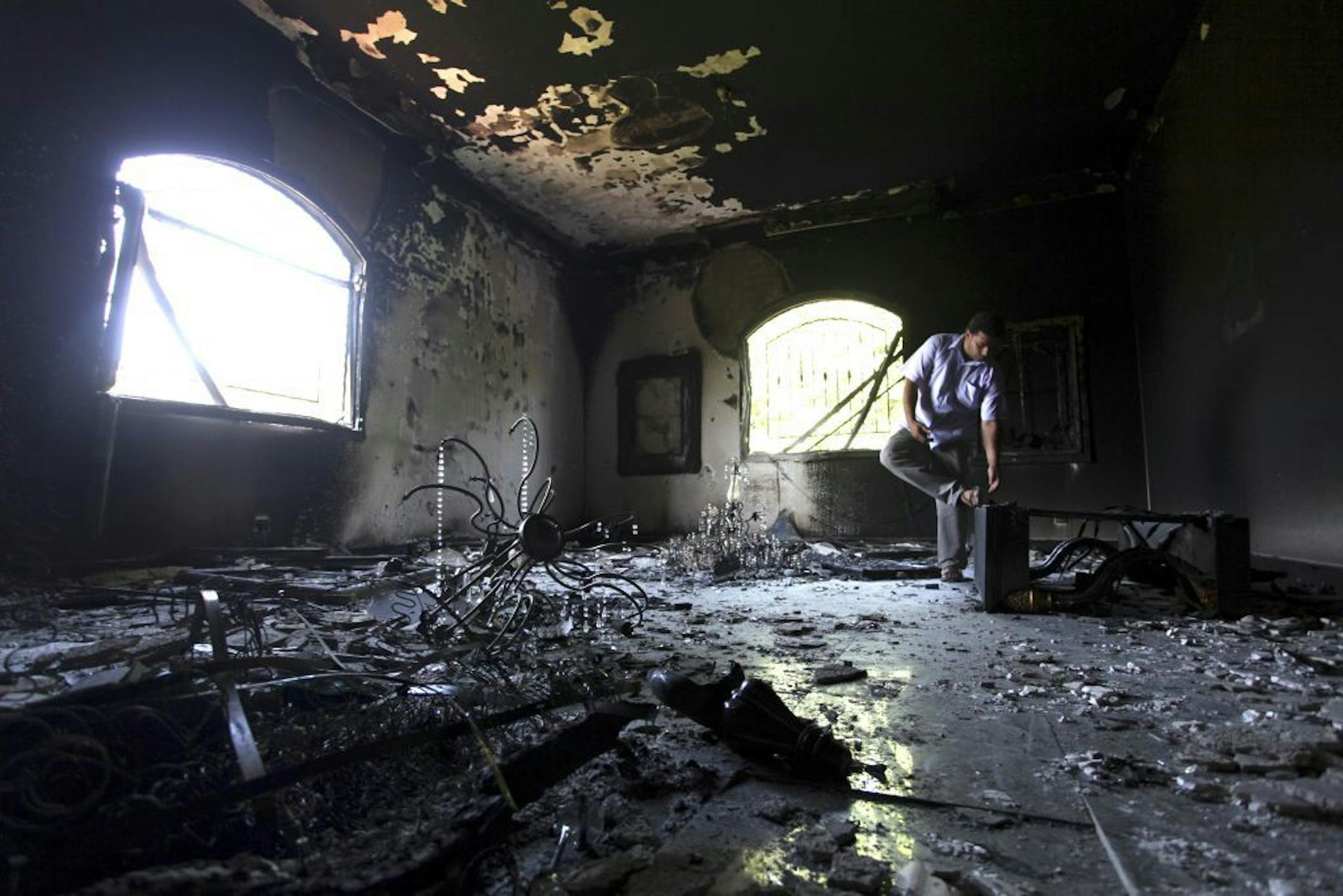 Sept. 13, 2012: A Libyan man investigates the inside of the U.S. Consulate, after an attack that killed four Americans, including Ambassador Chris Stevens.