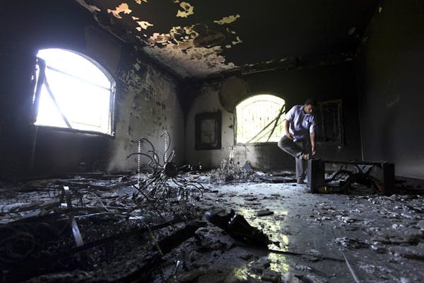 Sept. 13, 2012: A Libyan man investigates the inside of the U.S. Consulate, after an attack that killed four Americans, including Ambassador Chris Ste