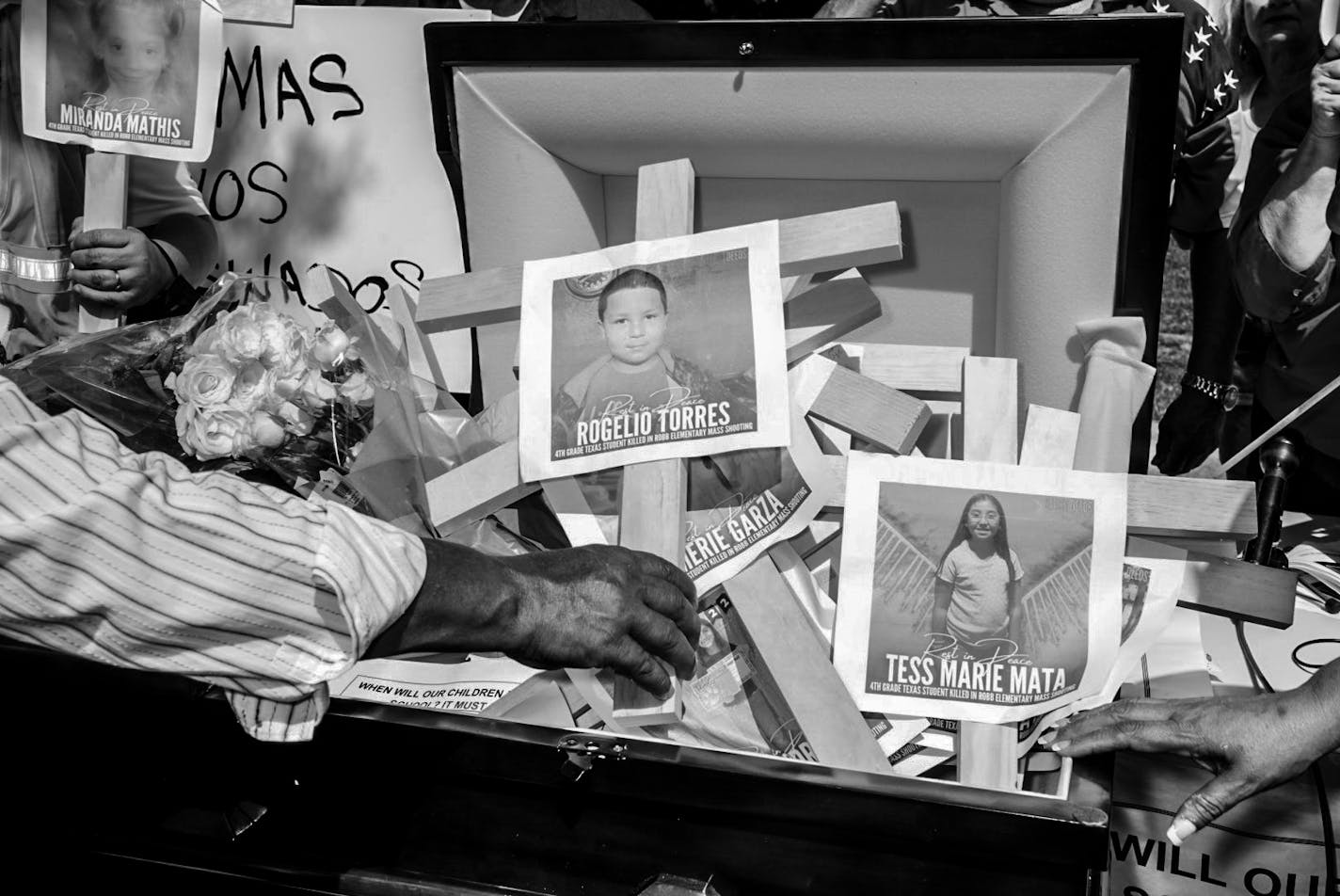 BC-OPINION-LINFIELD-UVALDE-SHOOTING-PHOTOS-ART-NYTSF — Images of children killed in the Uvalde school shooting during a protest outside the National Rifle Association convention in Houston, May 27, 2022. (Mark Peterson/The New York Times) — ONLY FOR USE WITH ARTICLE SLUGGED — BC-OPINION-LINFIELD-UVALDE-SHOOTING-PHOTOS-ART-NYTSF — OTHER USE PROHIBITED.