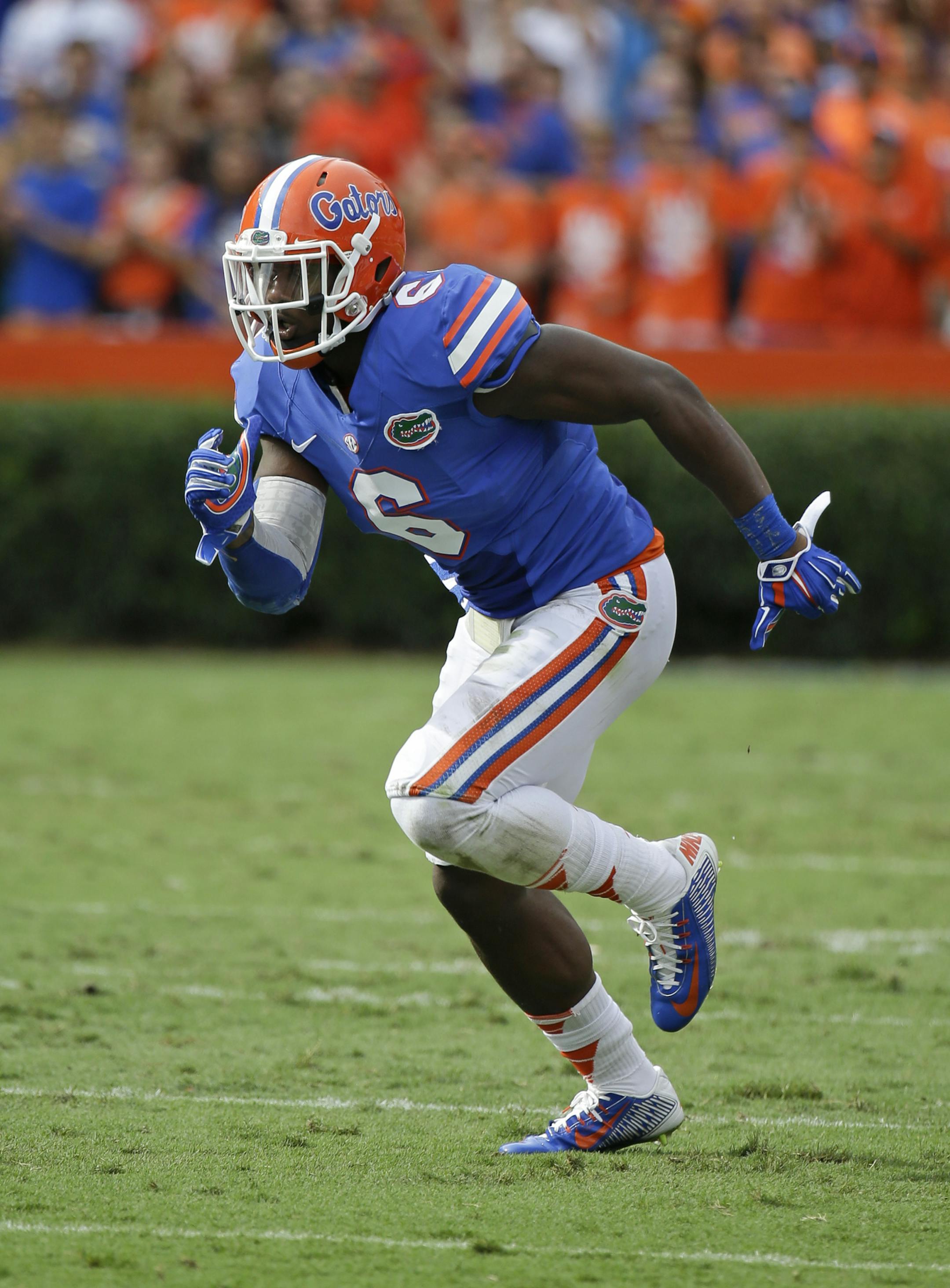 Florida defensive lineman Dante Fowler, Jr. (6) runs during a play against Eastern Michigan in the first half of an NCAA college football game in Gainesville, Fla., Saturday, Sept. 6, 2014. (AP Photo/John Raoux) ORG XMIT: GVP