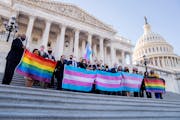 Democratic members of the U.S. House held LBGTQ and transgender pride flags outside the Capitol after the passage of the Equality Act in the House on 
