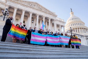 Democratic members of the U.S. House held LBGTQ and transgender pride flags outside the Capitol after the passage of the Equality Act in the House on 