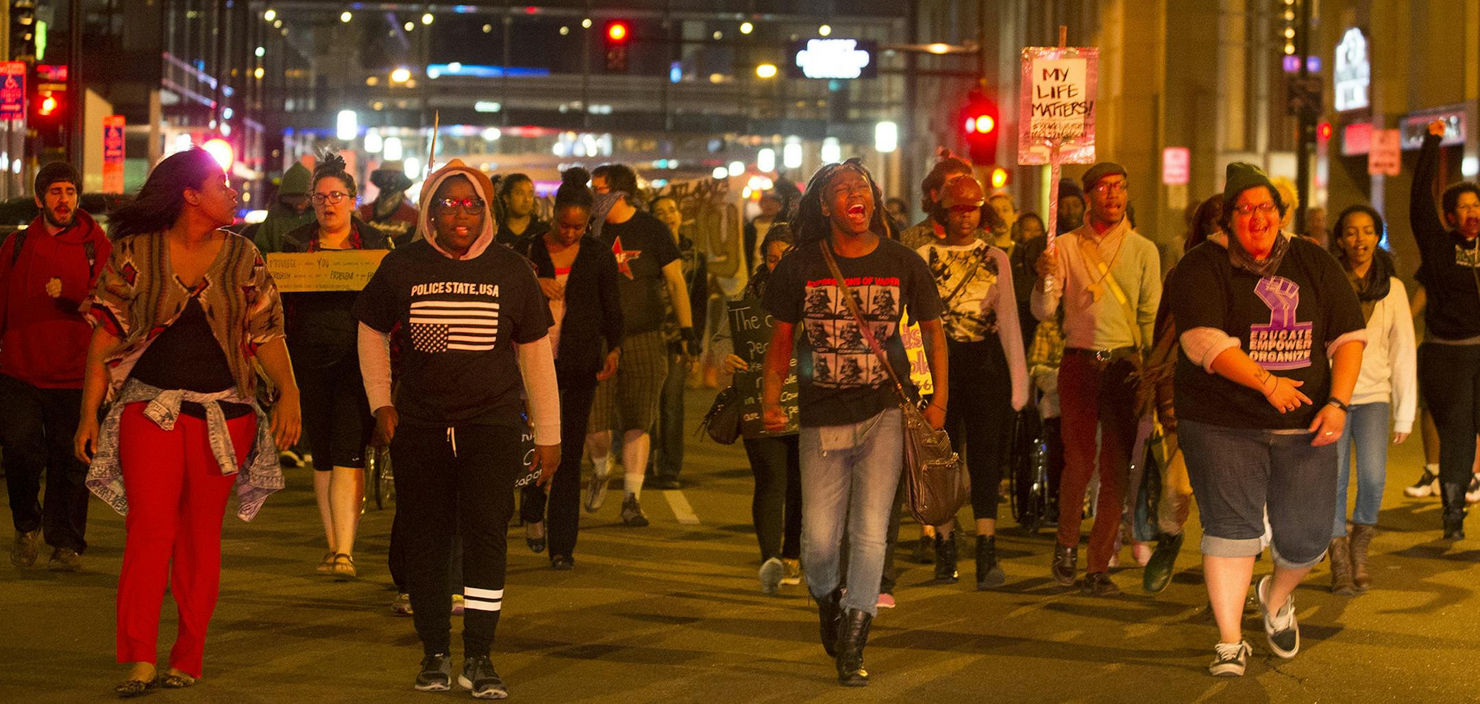 Between 50 and 100 protestors against police brutality march in downtown Minneapolis, Wednesday night, May 13, 2015. The police chief in Minneapolis has ordered an investigation into reports a child was pepper sprayed by an officer during the demonstration over a police shooting in Madison, Wisconsin. (Aaron Lavinsky/Star Tribune via AP) MANDATORY CREDIT; ST. PAUL PIONEER PRESS OUT; MAGS OUT; TWIN CITIES LOCAL TELEVISION OUT ORG XMIT: MIN2015051416261359
