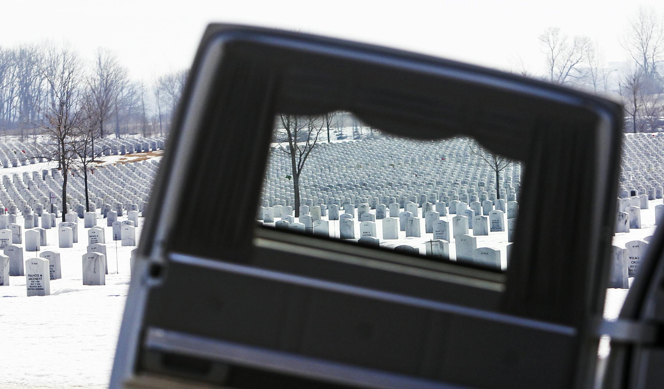 Tombstones were seen through the window of a hearse used in a training exercise involving members of the Minnesota National Guard Military Funeral Honor Guard Team and the Minneapolis Police Department Honor Guard.