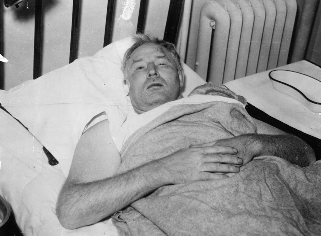 Walter Liggett in a hospital bed after he was attacked by seven men in October 1935, less than two months before his death.