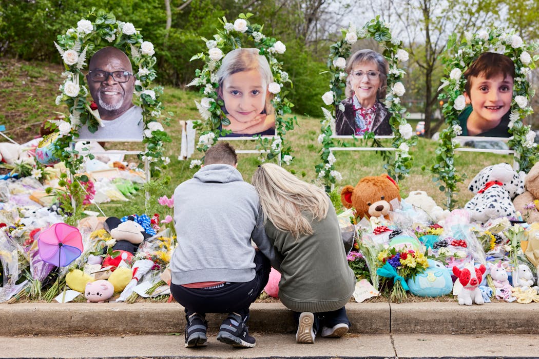 A couple prayed at a makeshift memorial for victims of the deadly March 27 shooting at Covenant School in Nashville.