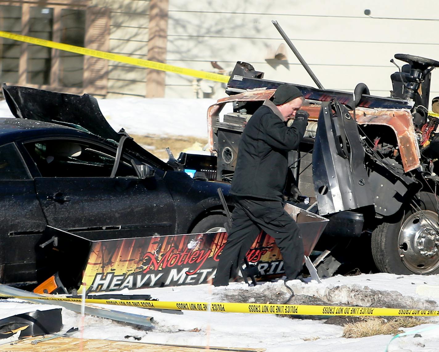 An investigator walks in the rubble that was the aftermath of a food truck explosion in Lakeville that happened late Friday night and was seen in the 16500 block of Joplin Path Saturday, March 7, 2015, in Lakeville, MN](DAVID JOLES/STARTRIBUNE)djoles@startribune.com Police responded to the scene on the 16500 block of Joplin Path around 11:30 p.m. after a loud boom erupted on the block. Photos posted on social media by neighbors show scraps of metal strewn across yards and driveway and some damag