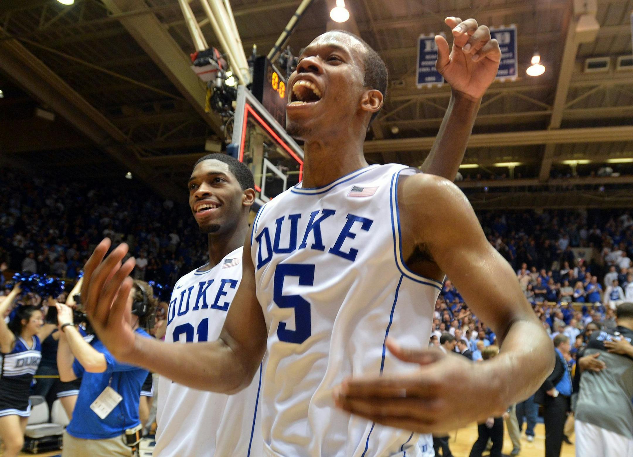 Duke's Rodney Hood (5) and teammate Amile Jefferson (21) celebrate as they leave the floor after a 93-81 victory against North Carolina at Cameron Indoor Stadium in Durham, N.C., Saturday, March 8, 2014. (Chuck Liddy/Raleigh News & Observer/MCT)