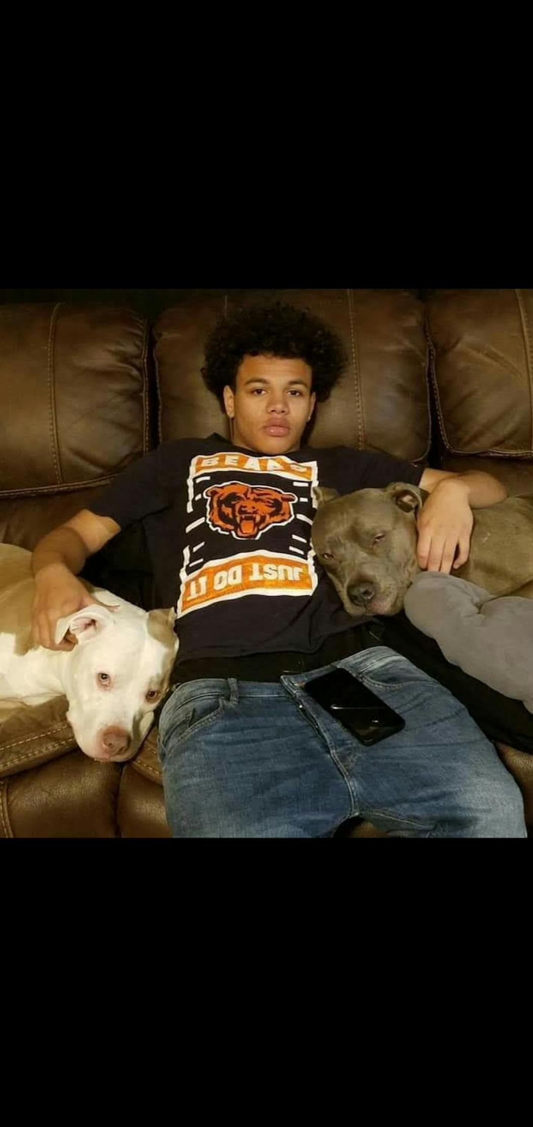 Caleb Livingston with his dogs, Ciroc and Rocko, before he was shot in the head in May 2019.
