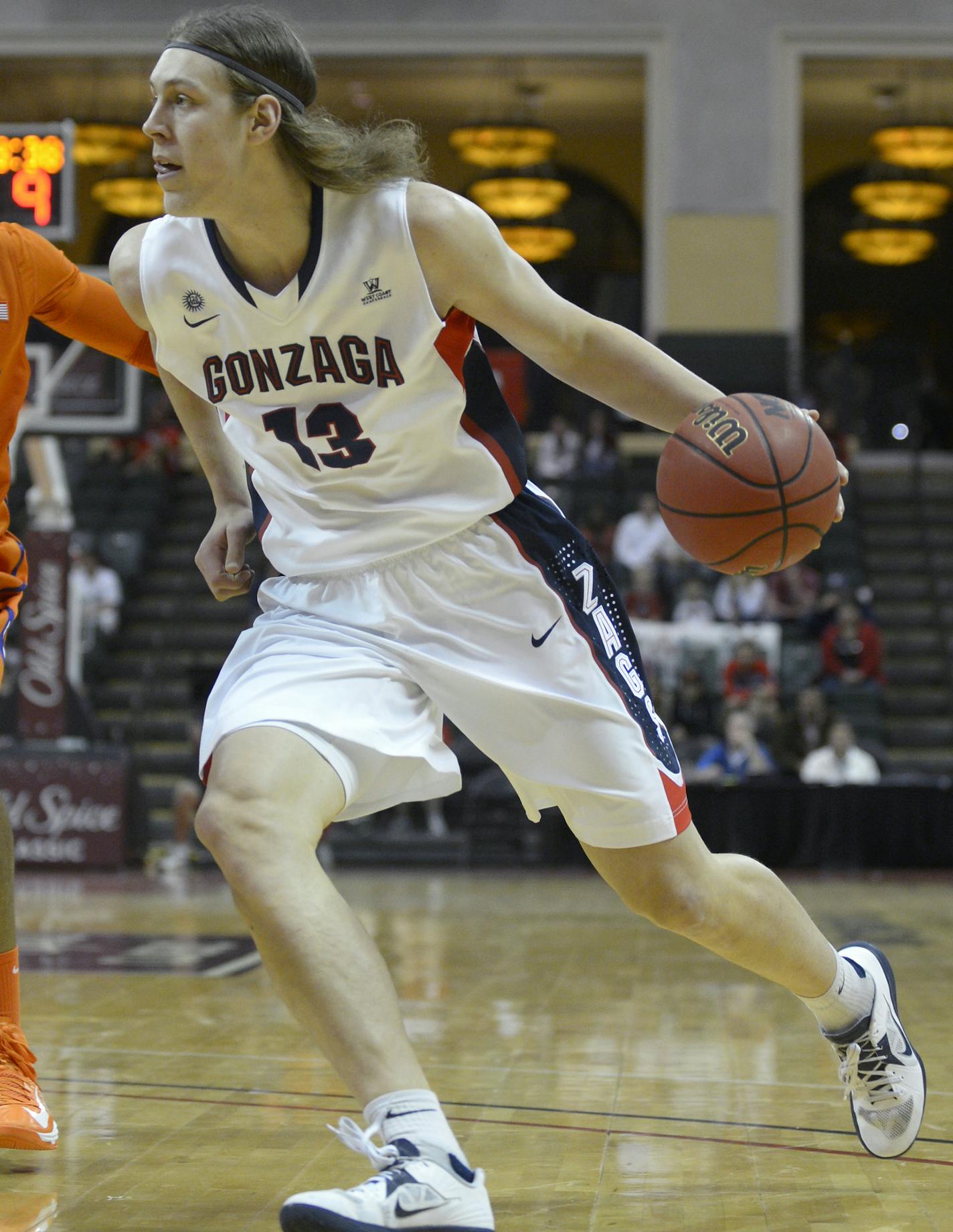 Gonzaga forward Kelly Olynyk (13) drives to the basket in front of Clemson center Devin Booker (31) during the first half of an NCAA college basketball game at the Old Spice Classic in Kissimmee, Fla., Thursday, Nov. 22, 2012.(AP Photo/Phelan M. Ebenhack) ORG XMIT: NYOTK