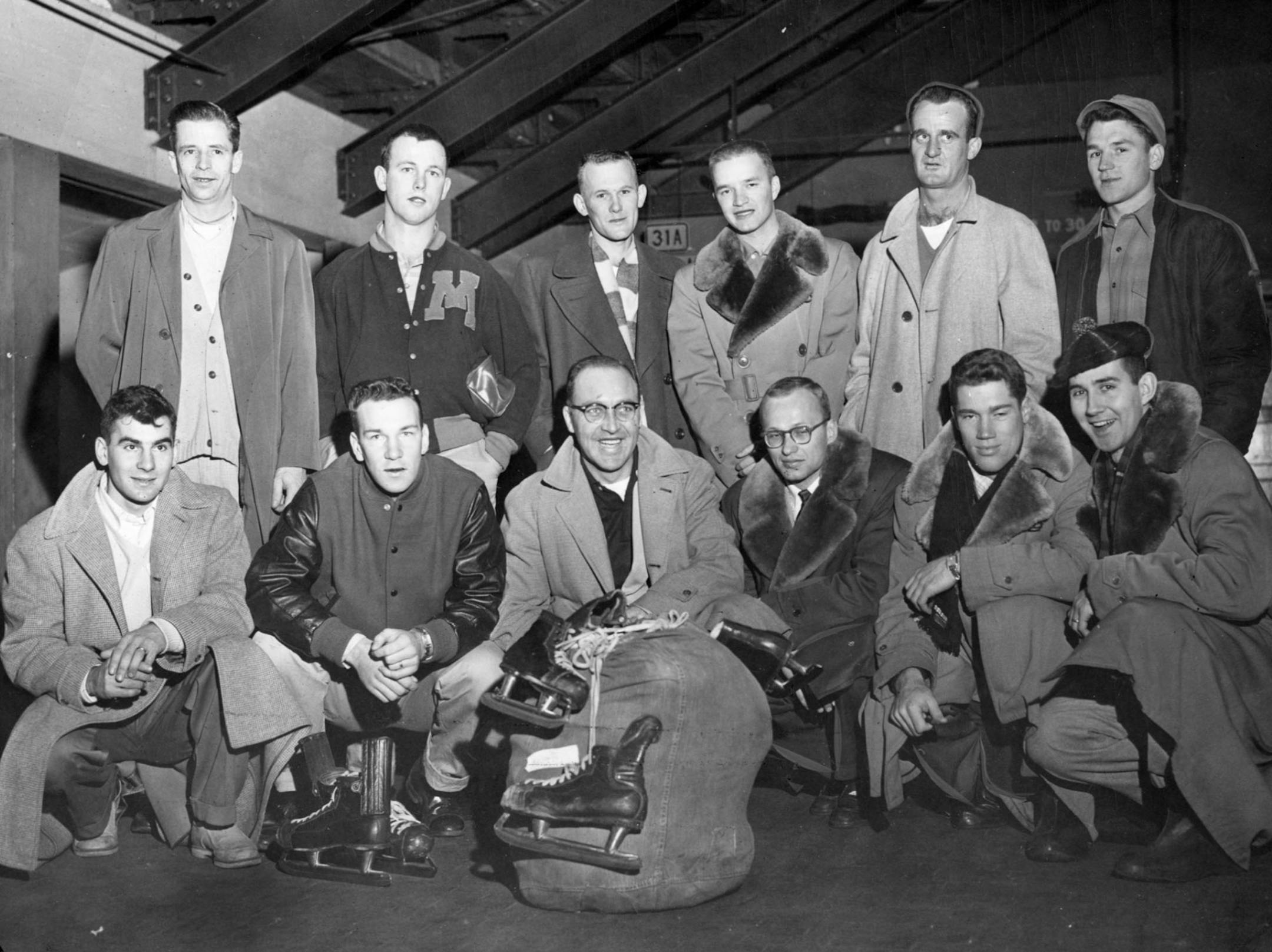 Midwest members of the 1956 US Olympic hockey team. Shown left to right in front are John Matchefts, John Mayasich, Dan McKinnon, Jim Sedin, Wendell Anderson, and Gene Campbell. Shown left to right in back are Ed Sampson, Richard (Dick) Dougherty, Ken Purpur, Willard Ikola, Gordon Christian, and Dick Meredith.