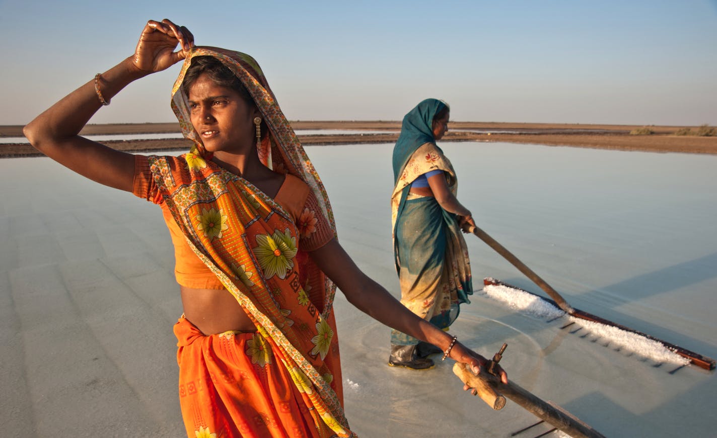 SEWA, the Self Employed Women's Association, helps women learn to build and repair solar lanterns in areas where no electricity exists. Salt workers can use solar lanterns after daylight hours to study by night.