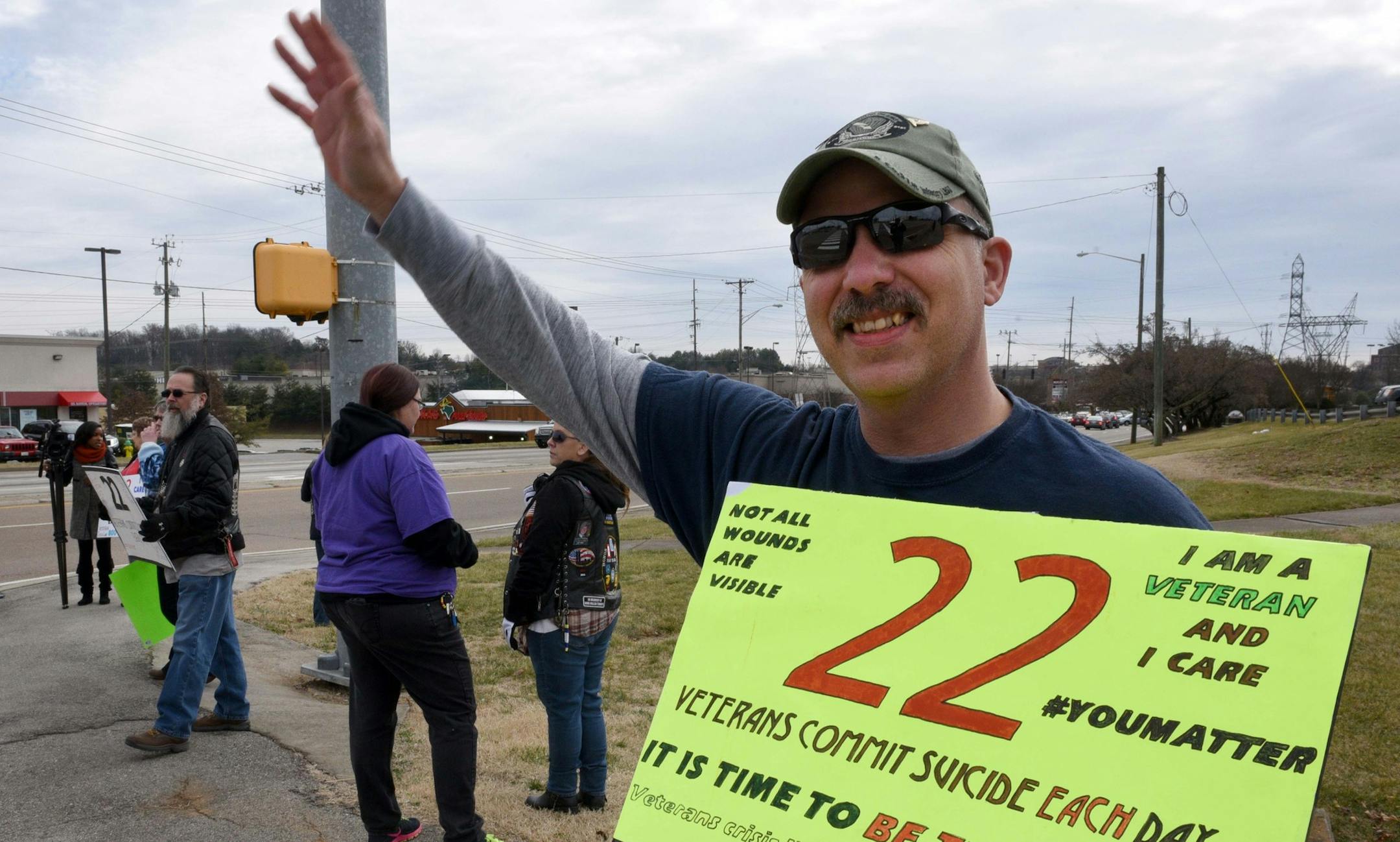 Don Tipton participates in a veteran suicide awareness campaign, Friday, Jan. 22, 2015, in Knoxville, Tenn. Tipton, a Knoxville Fire Department employee who served 10 years in the U.S. Army and 14 in the Air National Guard, plans to stand in a high-traffic area on the 22nd of each month to raise awareness. (AP Photo/Knoxville News Sentinel, Michael Patrick)
