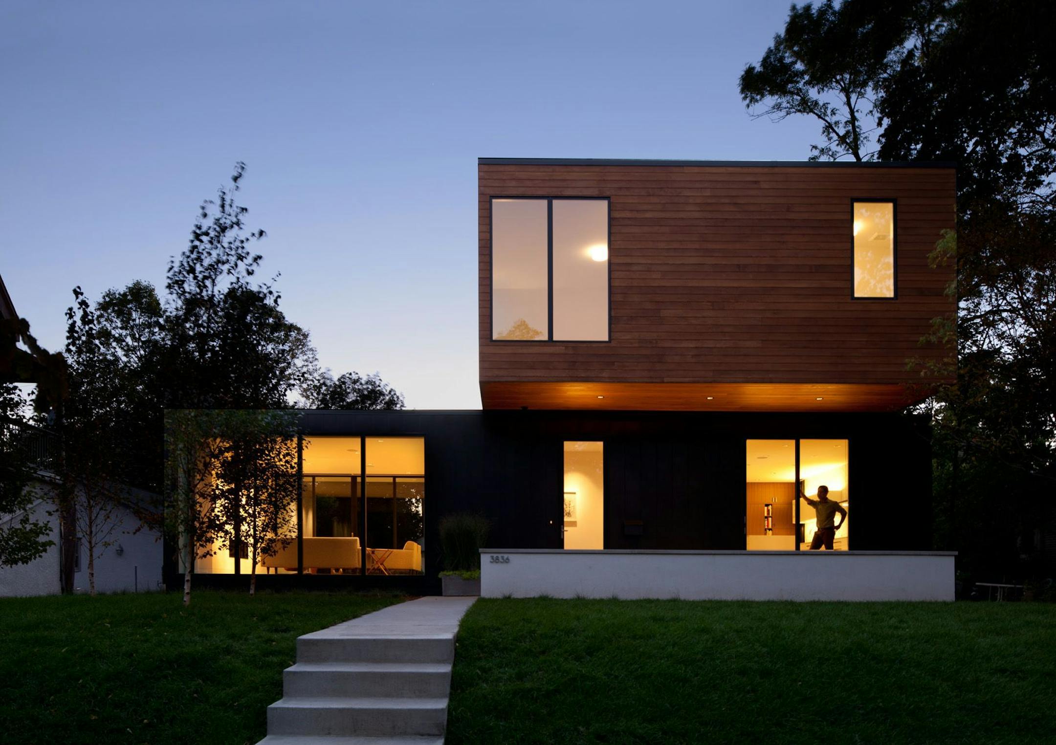 The flat roof, scale and simple materials create a low-key silhouette in a neighborhood of primarily older traditional homes.