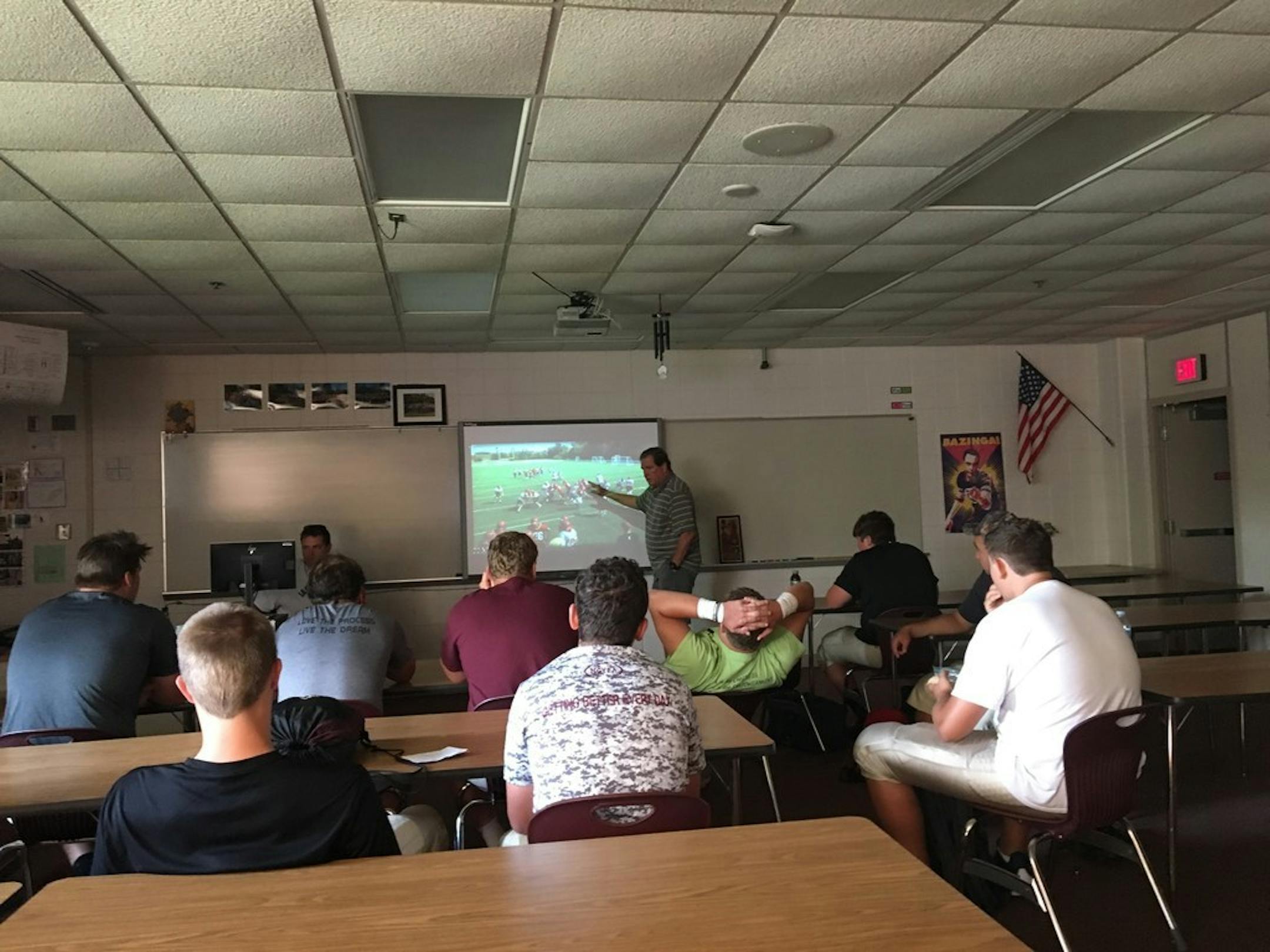 Maple Grove assistant coach Gordy Shaw gestured during a video session with Crimson players Friday morning.