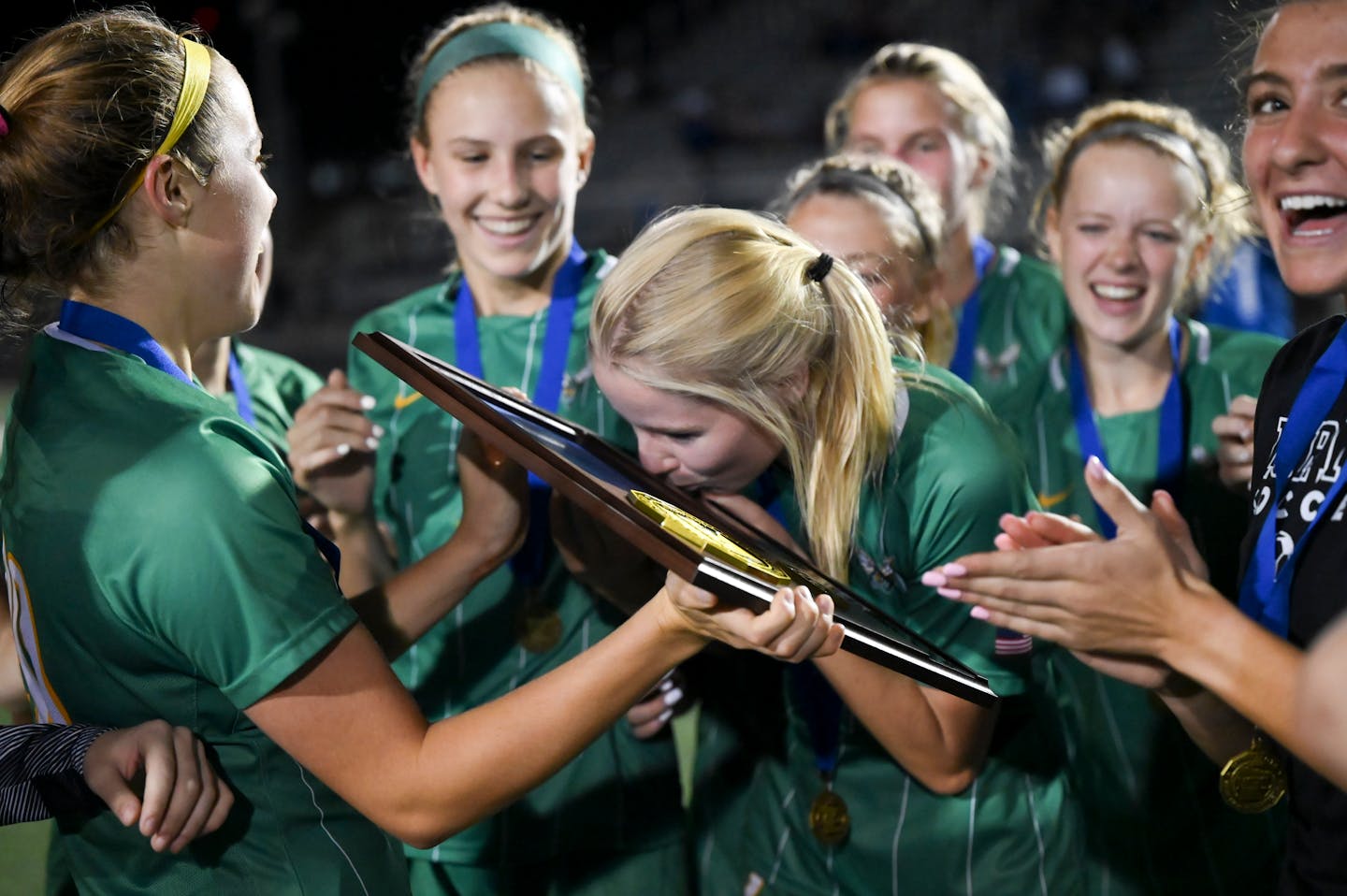 Edina midfielder Wesley MacMiller (4) kisses her team's trophy after their 5-0 victory against Minnetonka in the Class 3A, Section 2 Championship soccer game at Prior Lake High School Tuesday Oct. 19, 2021, in Savage, Minn. ] AARON LAVINSKY • aaron.lavinsky@startribune.com