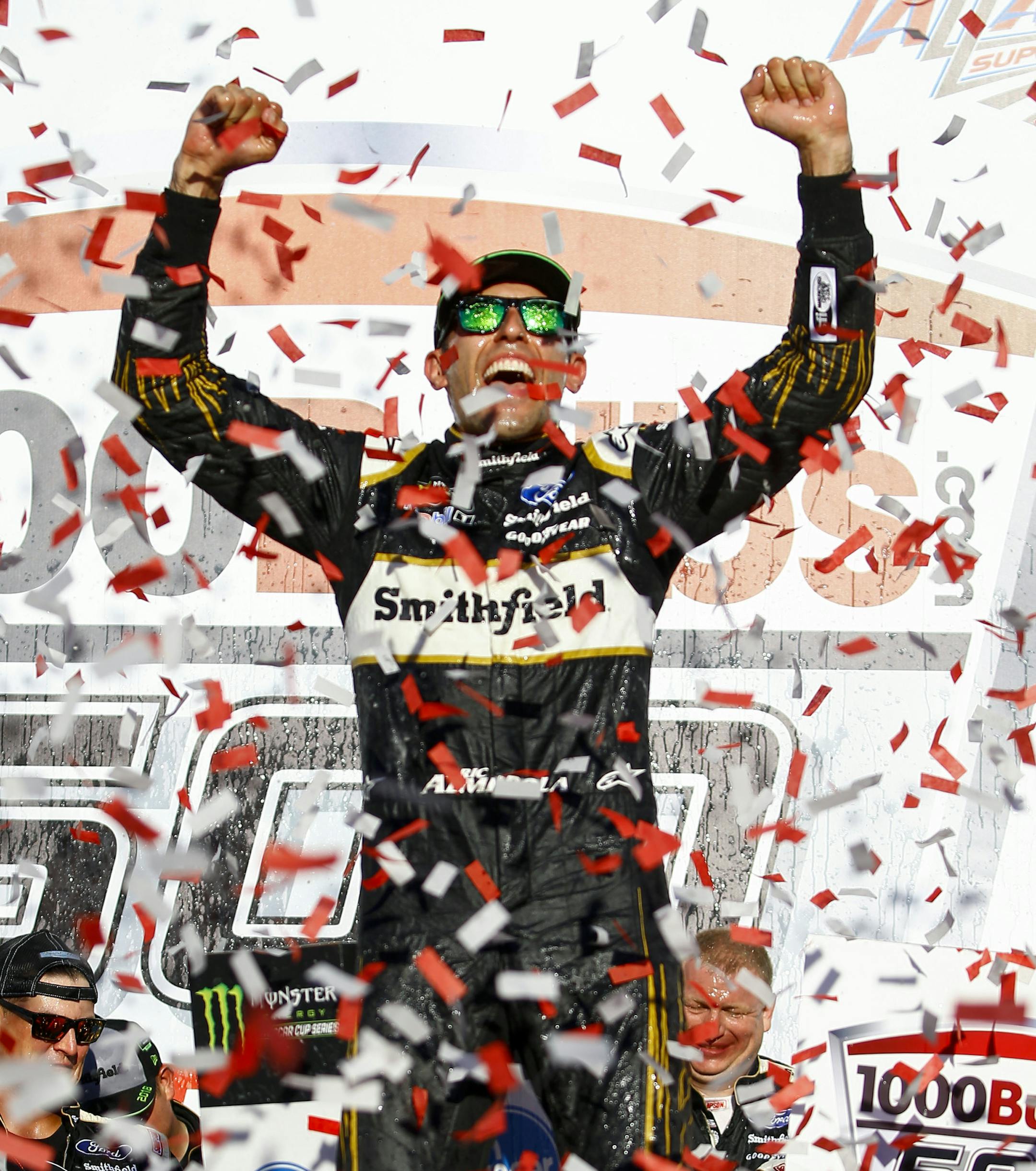 Aric Almirola celebrates in Victory Lane after winning the 1000Bulbs.com 500 NASCAR Cup Series auto race at Talladega Superspeedway, Sunday, Oct. 14, 2018, in Talladega, Ala. (AP Photo/Butch Dill)