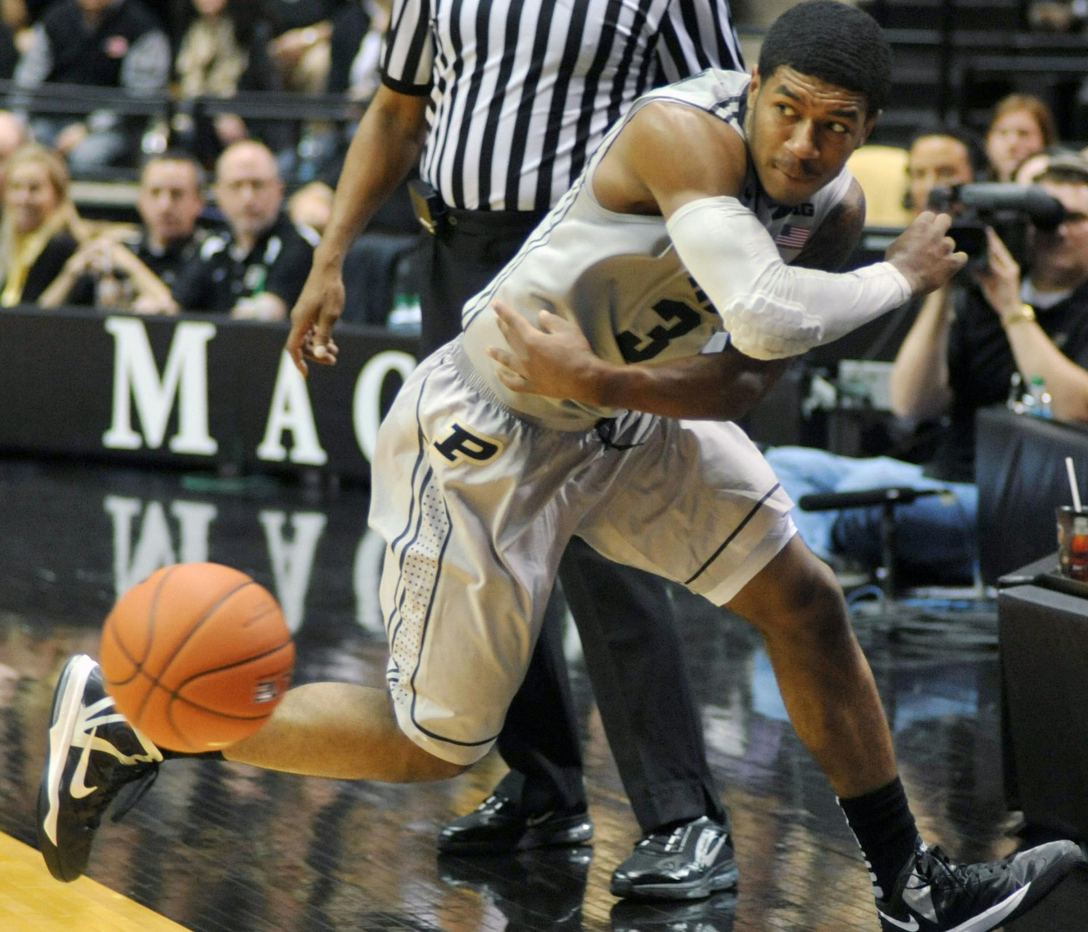 Purdue's Ronnie Johnson chases down a loose ball during an NCAA basketball game against Minnesota, Saturday, March 9, 2013, in West Lafayette, Ind. Purdue defeated Minnesota 89-73. (AP Photo/Journal & Courier, Alex Farris)
