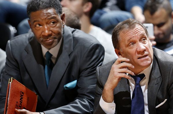 Minnesota Timberwolves coaches Sam Mitchell and Flip Saunders late in a game in January.