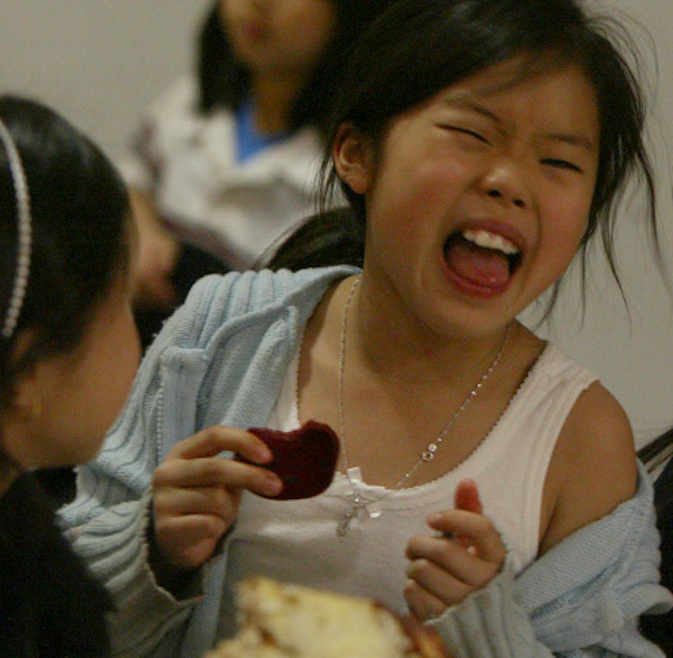 STORMI GREENER ' sgreener@startribune.com 5/4/2006 St. Paul, MN-- Nokomis Montessori School k-6th graders have a chance every yr. to make their choices for next years fresh veggies. Today, during their lunch hr. students were tasting  red and green peppers strips, pickled beets, portabella mushrooms slices and Jicama sticks.  not many students liked the beets, that seemed to be the least favorite. The jicama sticks were a hit with most of the students and the other two items fell somewhat short. THIS PHOTO: 8 yr. old Victoria Yang tasted her first ever pickled beet. A small bite of this veggie sent her into a gagging spasm. She and two of her friends said the tasting was nasty. Victoria says it was nasty...