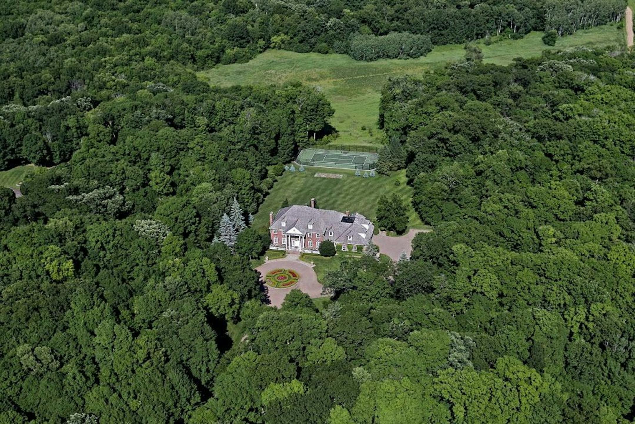 The 40-acre Medina property includes walking and biking trails and a tennis court.