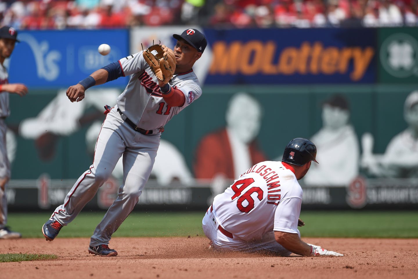 St. Louis Cardinals' Paul Goldschmidt, right, steals second base as Minnesota Twins second baseman Jorge Polanco, left, attempts to tag him out during the third inning of a baseball game Sunday, Aug. 1, 2021, in St. Louis. (AP Photo/Joe Puetz)