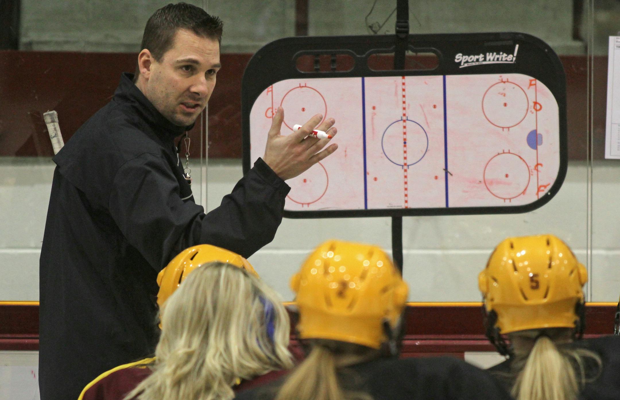 Gophers Women's Hockey Head Coach Brad Frost ran practice at Ridder Arena on 1/30/13.] Bruce Bisping/Star Tribune bbisping@startribune.com Brad Frost/roster. ORG XMIT: MIN1301301654002730