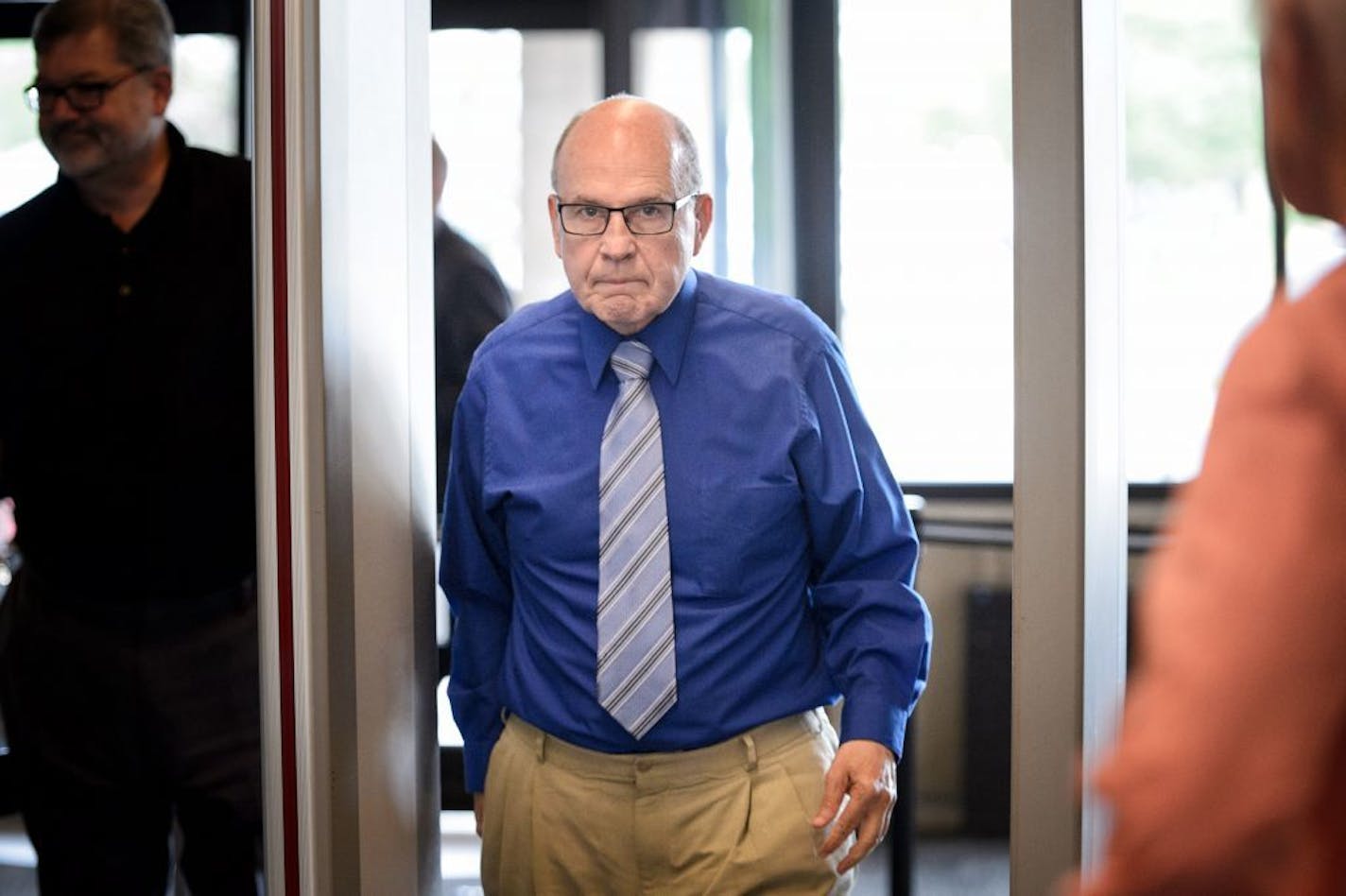 Former priest Francis Hoefgen passed through security at the Dakota County Judicial Center in Hastings.