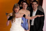 Taylor Swift accepted the award for album of the year for "Midnights" during the 66th annual Grammy Awards on Sunday in Los Angeles.