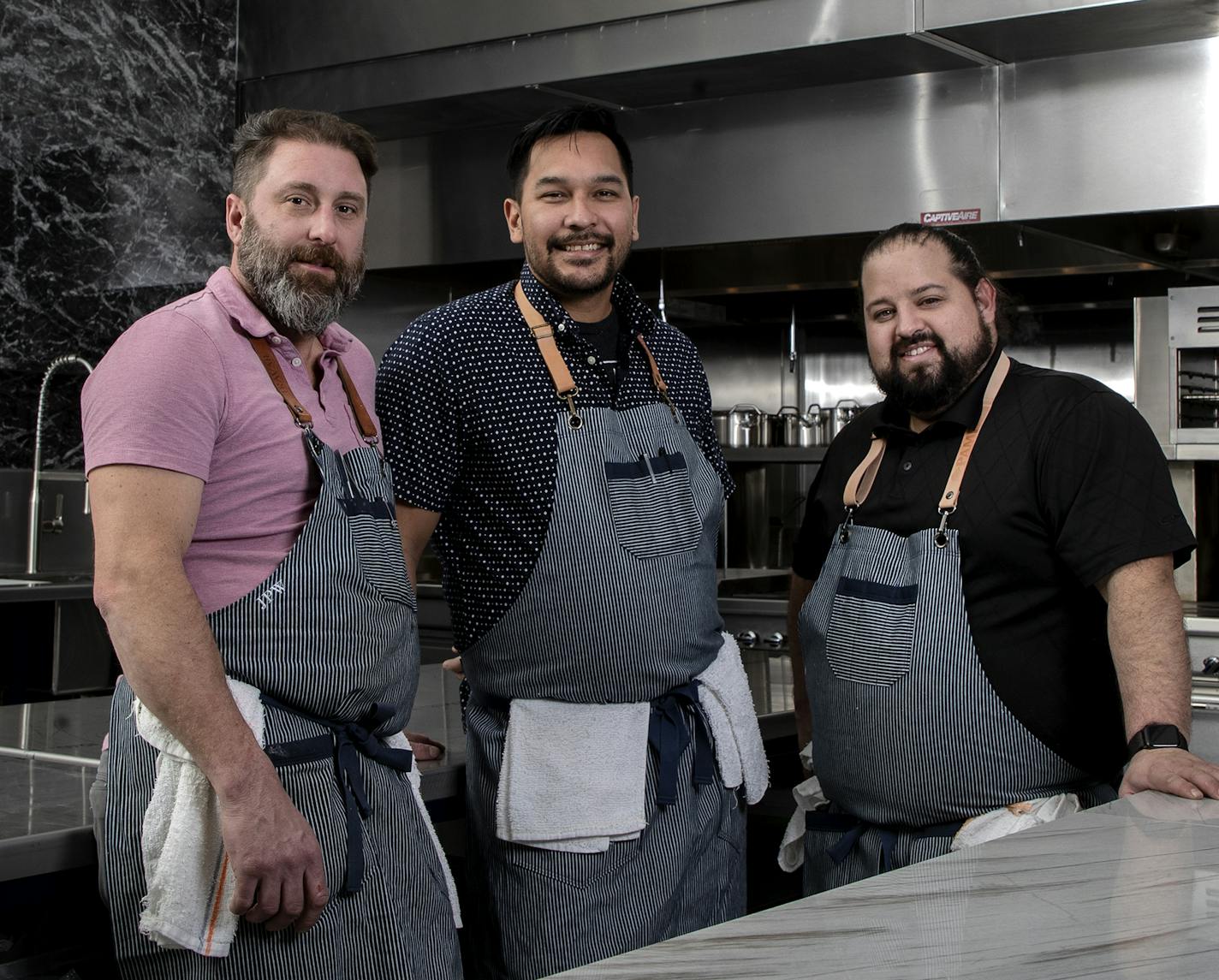 From left, James Winberg, Bob Gerken and Mike Brown of Travail Kitchen & Amusements.