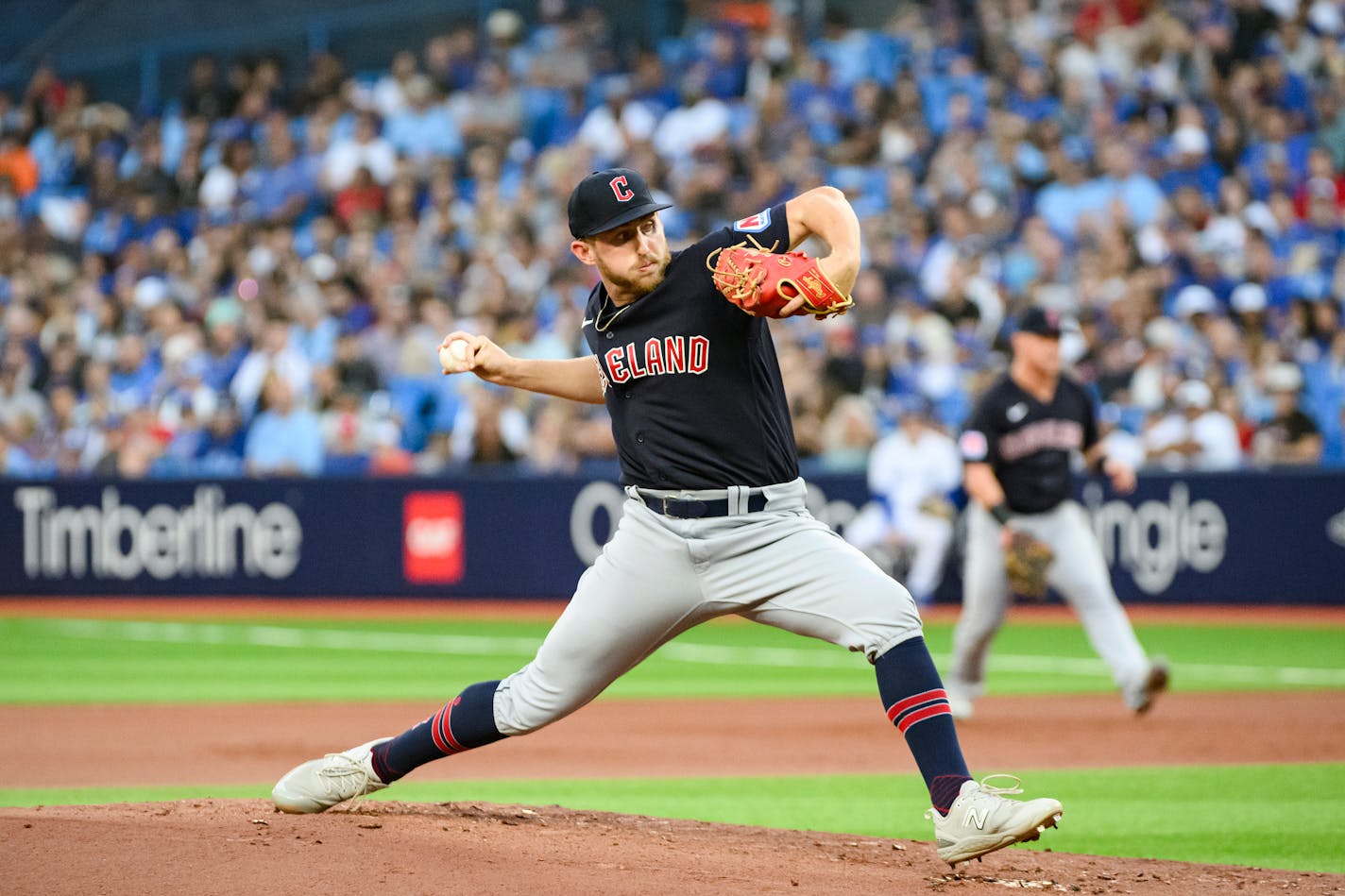 Cleveland Guardians starting pitcher Tanner Bibee works against the Toronto Blue Jays during the first inning of a baseball game Friday, Aug. 25, 2023, in Toronto. (Christopher Katsarov/The Canadian Press via AP)